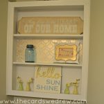 bathroom shelf makeover with gold paint and stenciling