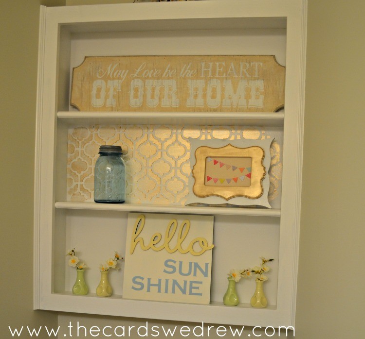 bathroom shelf makeover with gold paint and stenciling