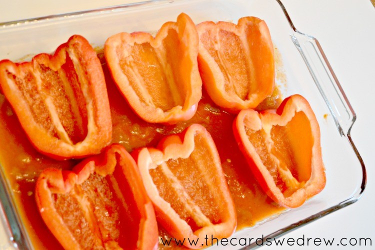 add halves of red peppers to pan